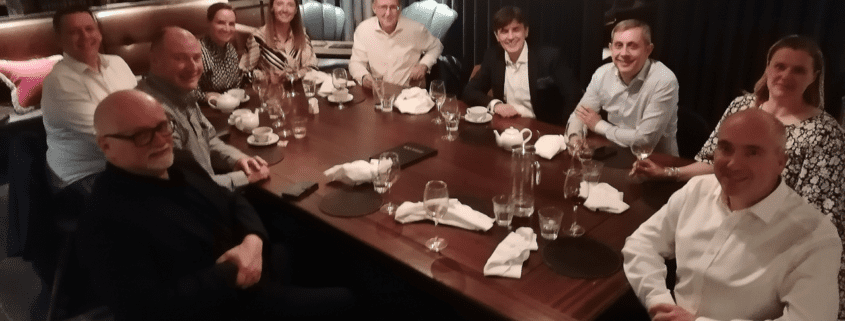 Senior business leaders meet around a table to discuss "Entrepreneurialism in B2B Sales", hosted by Customer Attuned